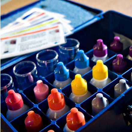 different colored caps on bottles in an AquaPhoenix test kit