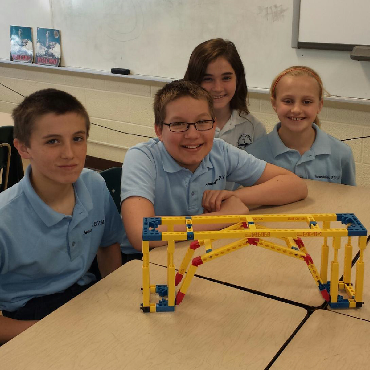 school children building bridge kits donated by AquaPhoenix